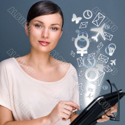 Portrait of pretty young woman holding Touch Screen tablet compu