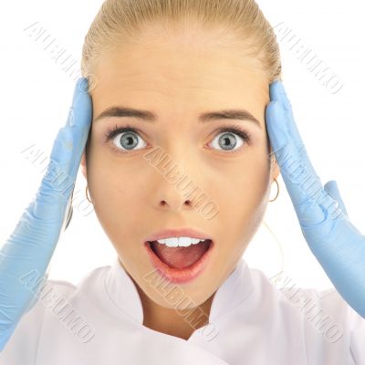 Surprised medical doctor woman. Isolated over white background