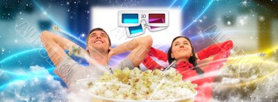 Close up of a cute couple watching movie on their home cinema st