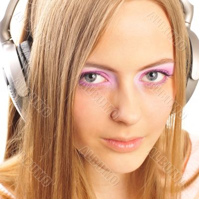 Beautiful woman with headphones, she is listening to the music