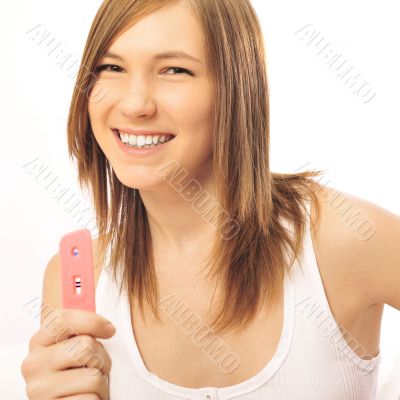 Pregnancy test - happy surprised woman, positive result Pregnancy test - happy surprised woman, positive result