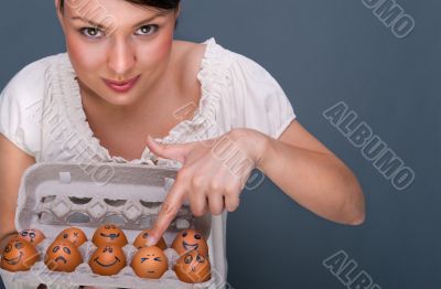 Portrait of young pretty business woman against grey background 