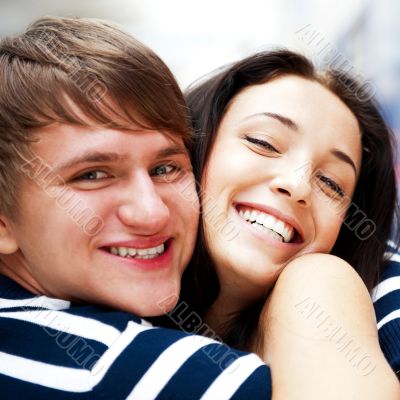 Young man meeting his girlfriend and embracing at airport arriva