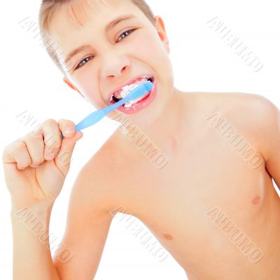 Beautiful boy brushing teeth, isolated on white