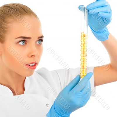 Isolated scientist woman in lab coat with chemical glassware. 