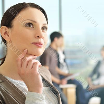 Portrait of a beautiful young businesswoman daydreaming.