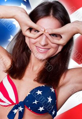 20-25 years old beautiful woman in swimsuit with american flag a
