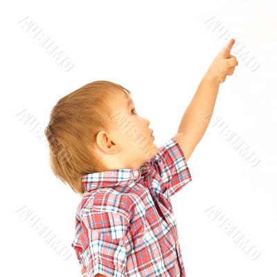 Portrait of happy little boy over white background looking away 