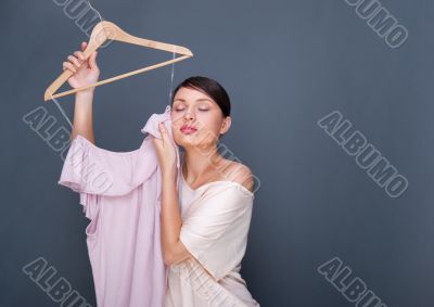 Portrait of pretty fashionable woman trying new clothes. Fashion