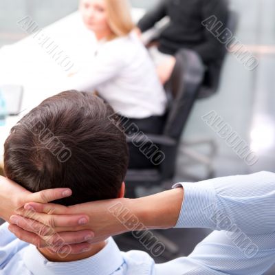 Closeup portrait of a smart young businessman smiling and his co