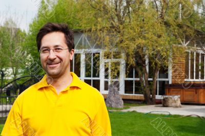 Portrait of adult active healthy man standing relaxed at his bac