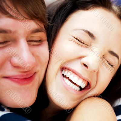 Young man meeting his girlfriend with opened arms at airport arr