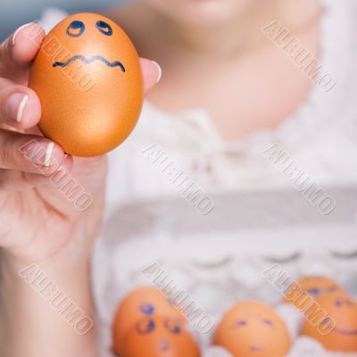 Portrait of young pretty business woman against grey background 