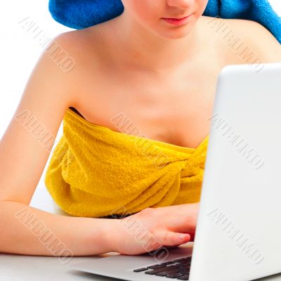 young beautiful smiling woman prints on the laptop - indoors