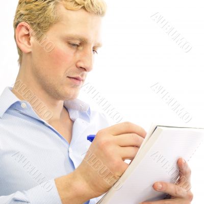 Closeup portrait of a cheerful young business man signing docume