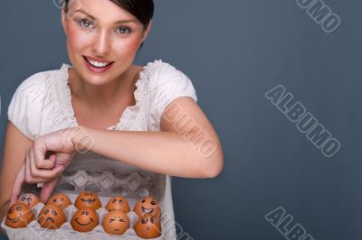 Portrait of young pretty business woman against grey background 