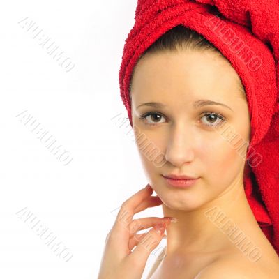 Beautiful young woman after shower with towel on her head