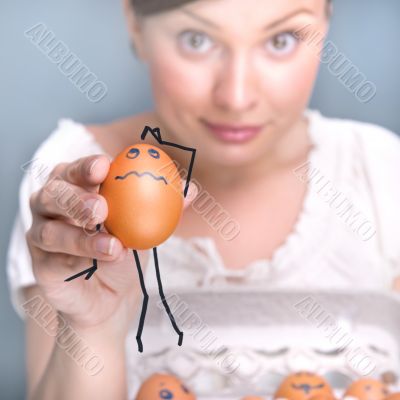 Portrait of young pretty business woman against grey background 