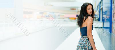 Portrait of beautiful excited relaxed young woman standing at th