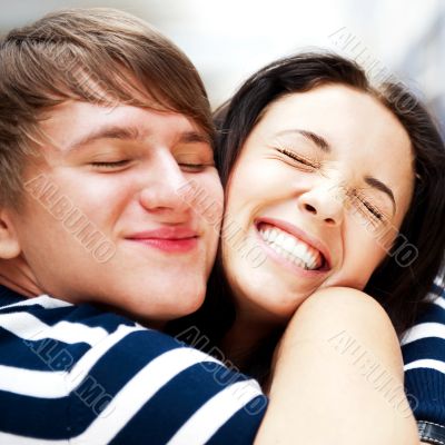 Young man meeting his girlfriend and embracing at airport arriva