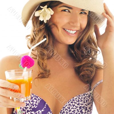 Woman drinking orange juice and wearing summer hat. Vacation con