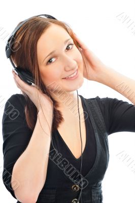 Beautiful woman with headphones, she is listen to the music