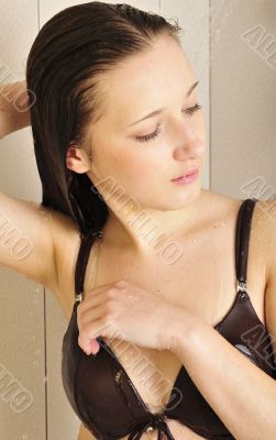 Beautiful young woman take shower