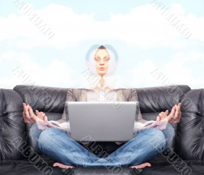 Portrait of young business woman sitting with a laptop on comfor