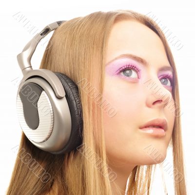 Beautiful woman with headphones, she is listening to the music