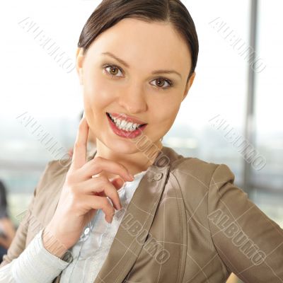 Portrait of a beautiful young businesswoman smiling at a meeting