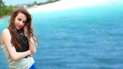 Beautiful brunette woman resting on the beach