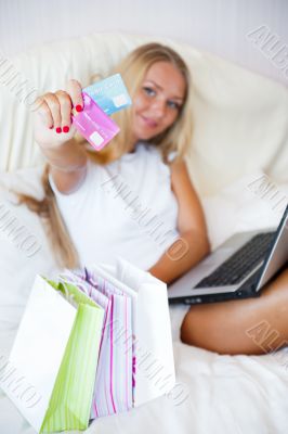 Cute online shopping girl at her home