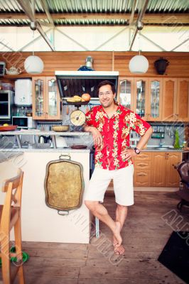 Artistic lifestyle photo of adult friendly man at his kitchen at