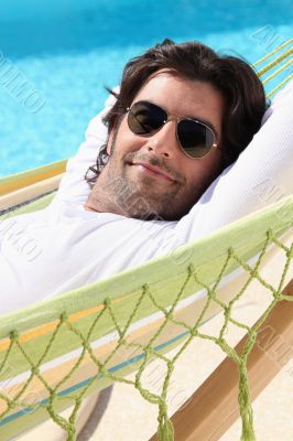 Man relaxing by the pool