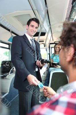 conductor checking tickets on a tram