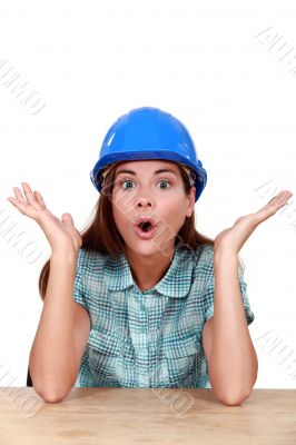 Surprised female construction worker