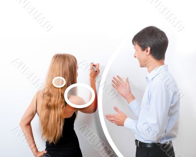 Confident adult teacher helping to students in school classroom Confident adult teacher helping to students in school classroom
