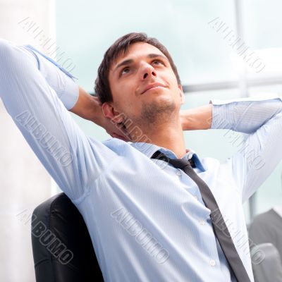 Closeup portrait of a smart young businessman smiling and his co