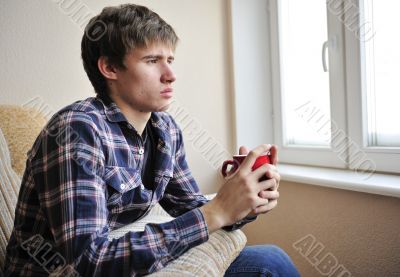 Happy young handsome man at home Happy young handsome man at home