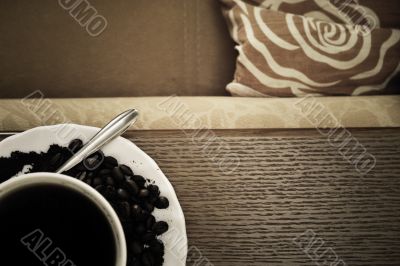 warm cup of coffee on brown background