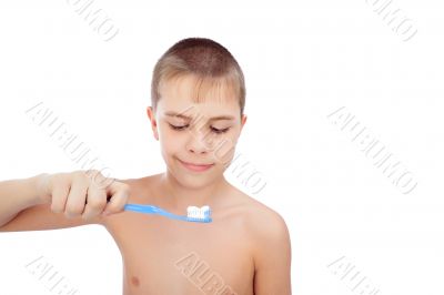 Beautiful boy brushing teeth, isolated on white