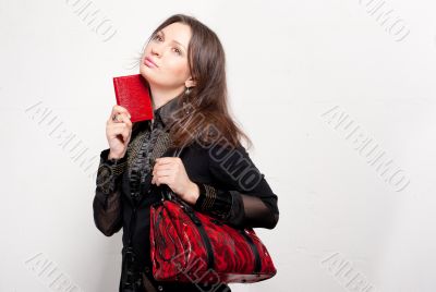 Portrait of a bright beautiful young woman with fashion  handbag