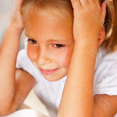 Image of smart child reading interesting book in classroom