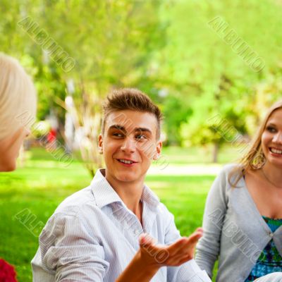 Portrait of three young teenagers laughing and having fun togeth