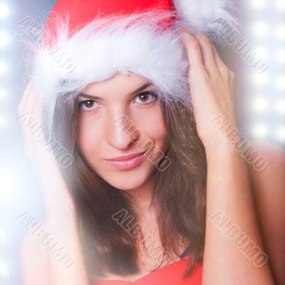 20-25 years od beautiful woman in christmas dress dancing at clu