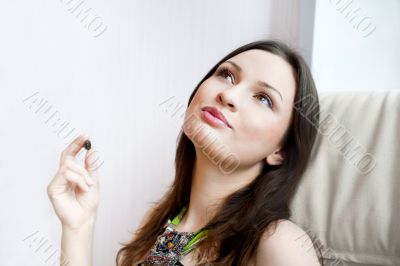 Portrait of smiling beautiful young brunette woman at home