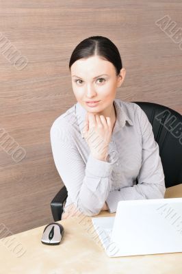 Portrait of a beautiful young businesswoman on the computer, mak