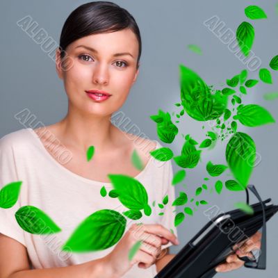 Portrait of young woman standing indoors at her office and worki