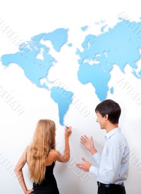 Geography lesson. Adult teacher giving presentation on white boa Geography lesson. Adult teacher giving presentation on white boa