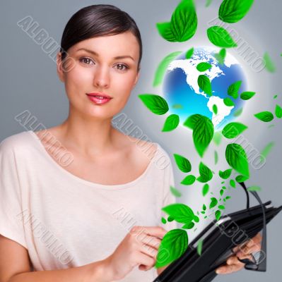 Portrait of young woman standing indoors at her office and worki